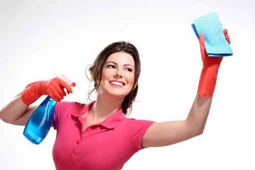 Staff moving equipment safely during a carpet cleaning job